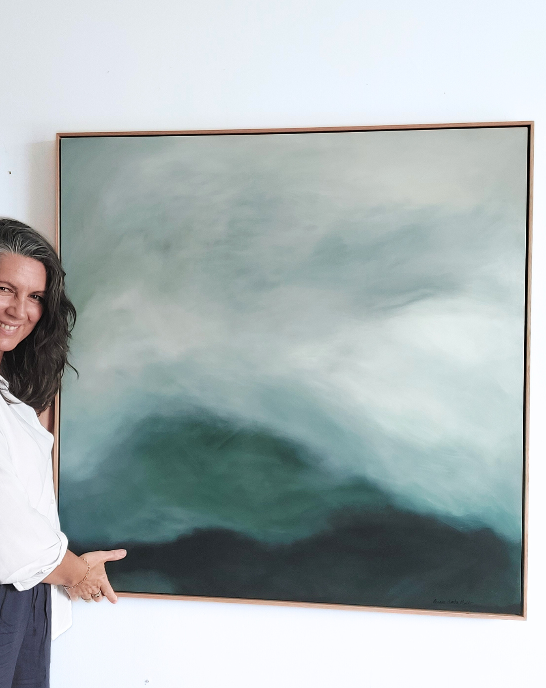 Leanne Aroha Mulder with her original painting After the Rain