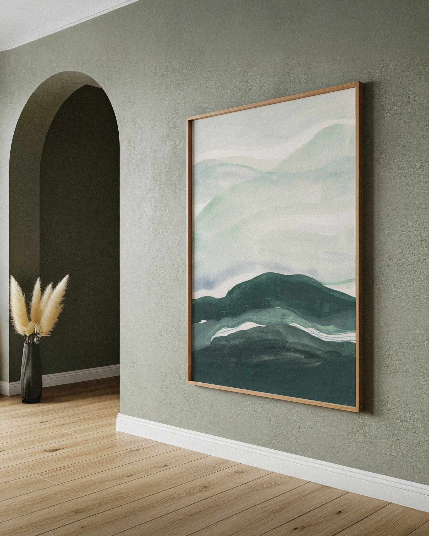 Framed abstract artwork on a green wall with a vase of pampas grass. Abstract layered lands painting by leanne Aroha Mulder